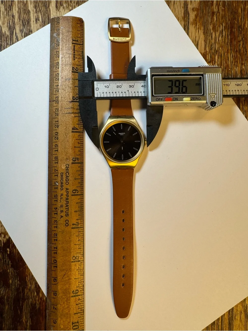 Swatch Skinsand SYXG104 gold-tone and leather analog watch
